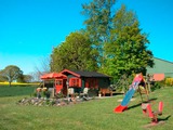 Ferienwohnung in Rettin - Ferienhof Hansen Sanddorn - Das Gartenhaus mit Spielplatz