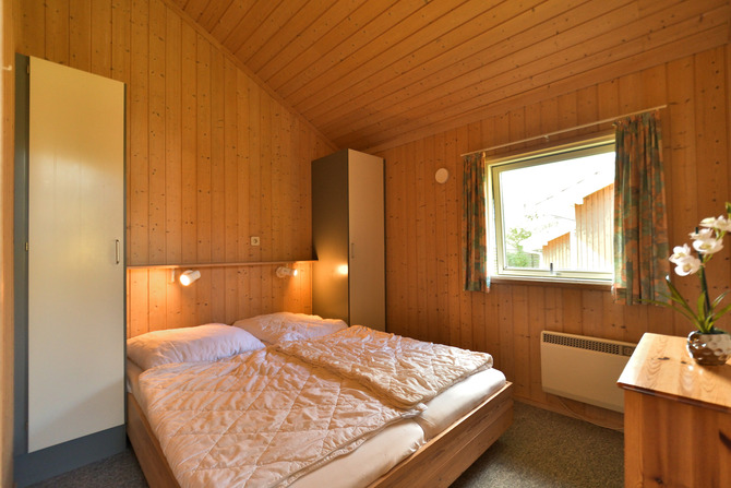 Ferienhaus in Pelzerhaken - Am Waldrand Haus D - Schlafzimmer mit Doppelbett